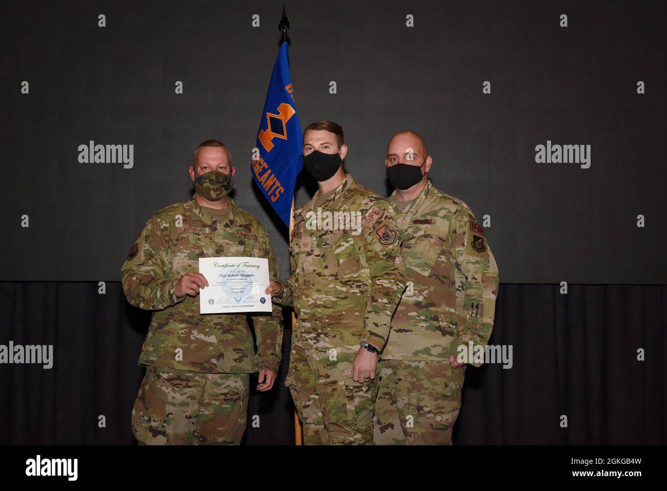 Tech. Sgt. Robert Thigpen, 51st Operations Support Squadron, accepts his certificate of training for successfully completing the First Sergeant Symposium course on Osan Air Base, Republic of Korea, April 15, 2021. Stock Photo