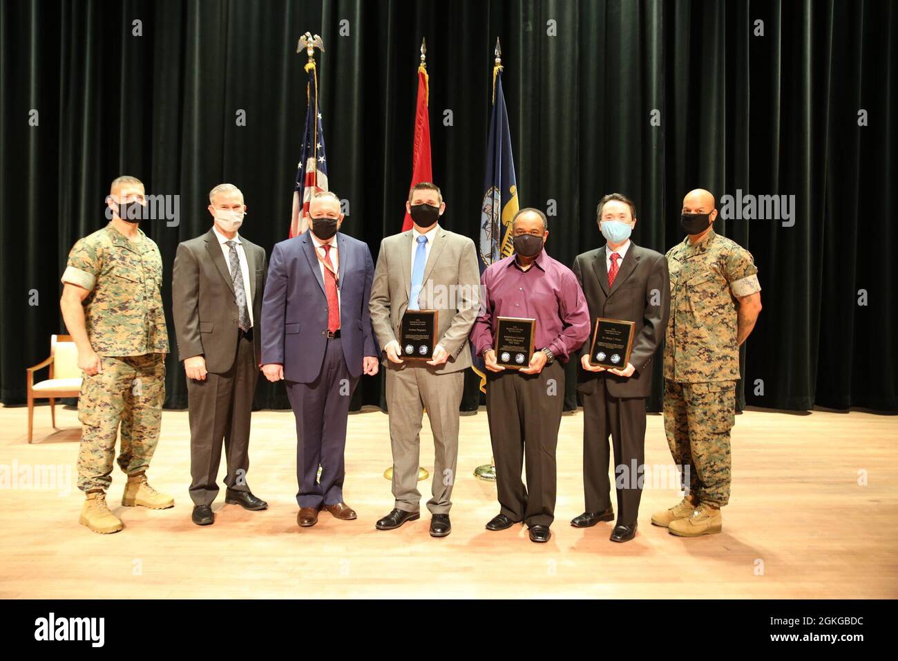 Marine Corps Systems Command’s Brig. Gen. A.J. Pasagian; U.S. Navy Executive Director for Innovation, Technology Requirements and Test and Evaluation Rick Quade; PEO Land System’s John Garner; and MCSC’s Sgt. Maj. Michael Cato pose with MCSC’s Department of Navy T&E Awards winners Andrew Ferguson, Lou Ferguson and Dr. Giang Pham, April 15, aboard Marine Corps Base Quantico, Virginia. Not pictured: Maj. Richard Zjawin. Stock Photo