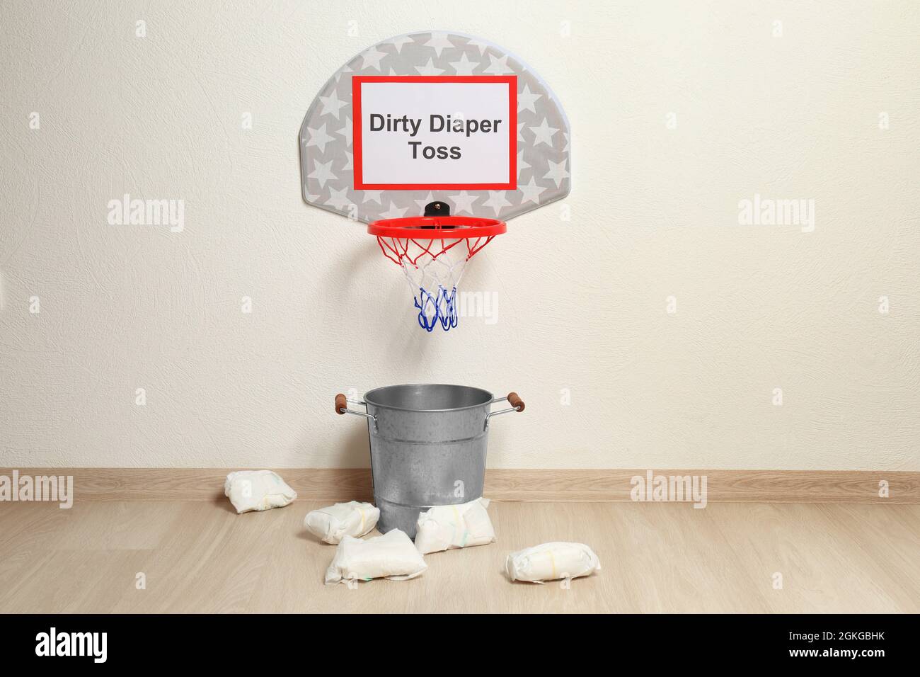Basketball hoop, bucket and diapers for game at baby shower party Stock