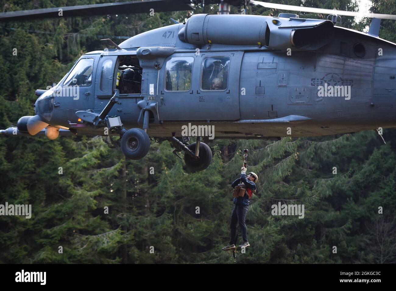 Members from the 56th Rescue Squadron hoist U.S. Air Force Capt. Alex ...