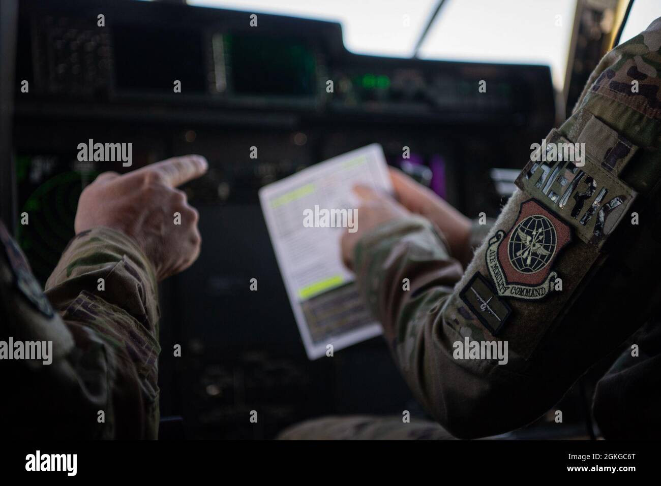 Pilots from the 61st Airlift Squadron prepare for the 2021 Swamp Dash exercise at Little Rock Air Force Base, Arkansas, April 15, 2021. The 19th Airlift Wing executed the large formation launch and training event with mission partners, which included 13 C-130J Super Hercules from LRAFB and two C-130Js from Dyess AFB, Texas. Stock Photo