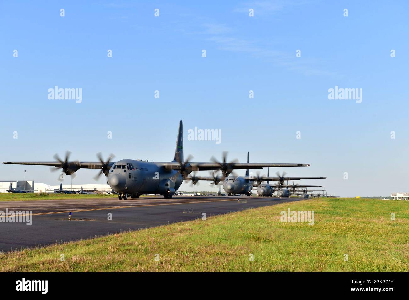 Twelve C-130J Super Hercules line up for the 2021 Swamp Dash exercise at Little Rock Air Force Base, Arkansas, April 15, 2021. The 19th Airlift Wing executed the large formation launch and training event with mission partners, which included 13 C-130J Super Hercules from Little Rock AFB and two C-130Js from Dyess AFB, Texas. Stock Photo