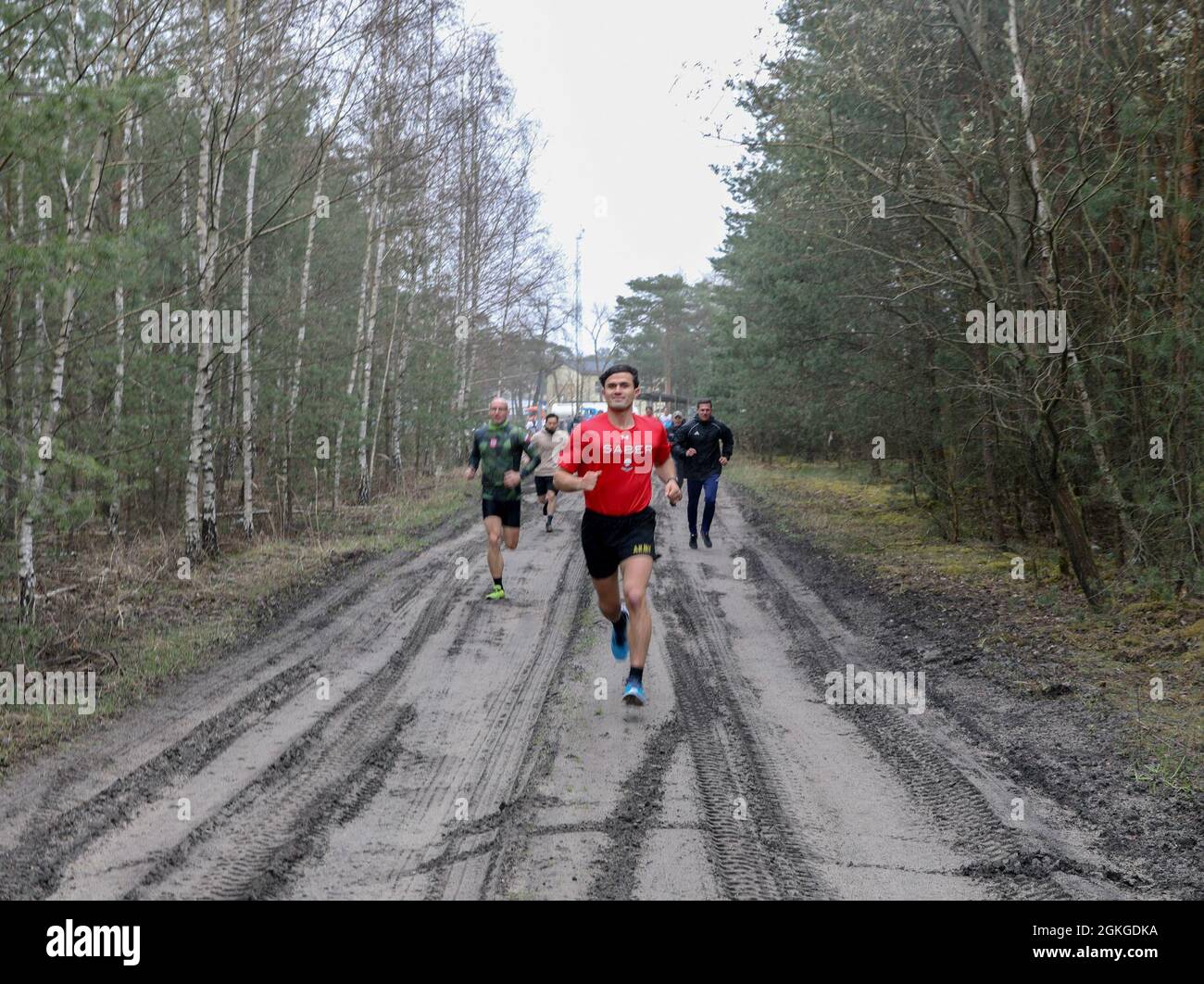 U.S. Army 1st Lt. Kyle Warner, 1st Armored Brigade Combat Team, 1st Cavalry Division, competes in the inaugural Better Opportunities for Single Soldiers Poland event, a 5K competition held at Zagan Forward Operating Station, Poland, April 15, 2021. BOSS Poland is the first-ever BOSS program to be established for deployed and rotational troops, instituted by a U.S. Army Reserve civil affairs team. Stock Photo