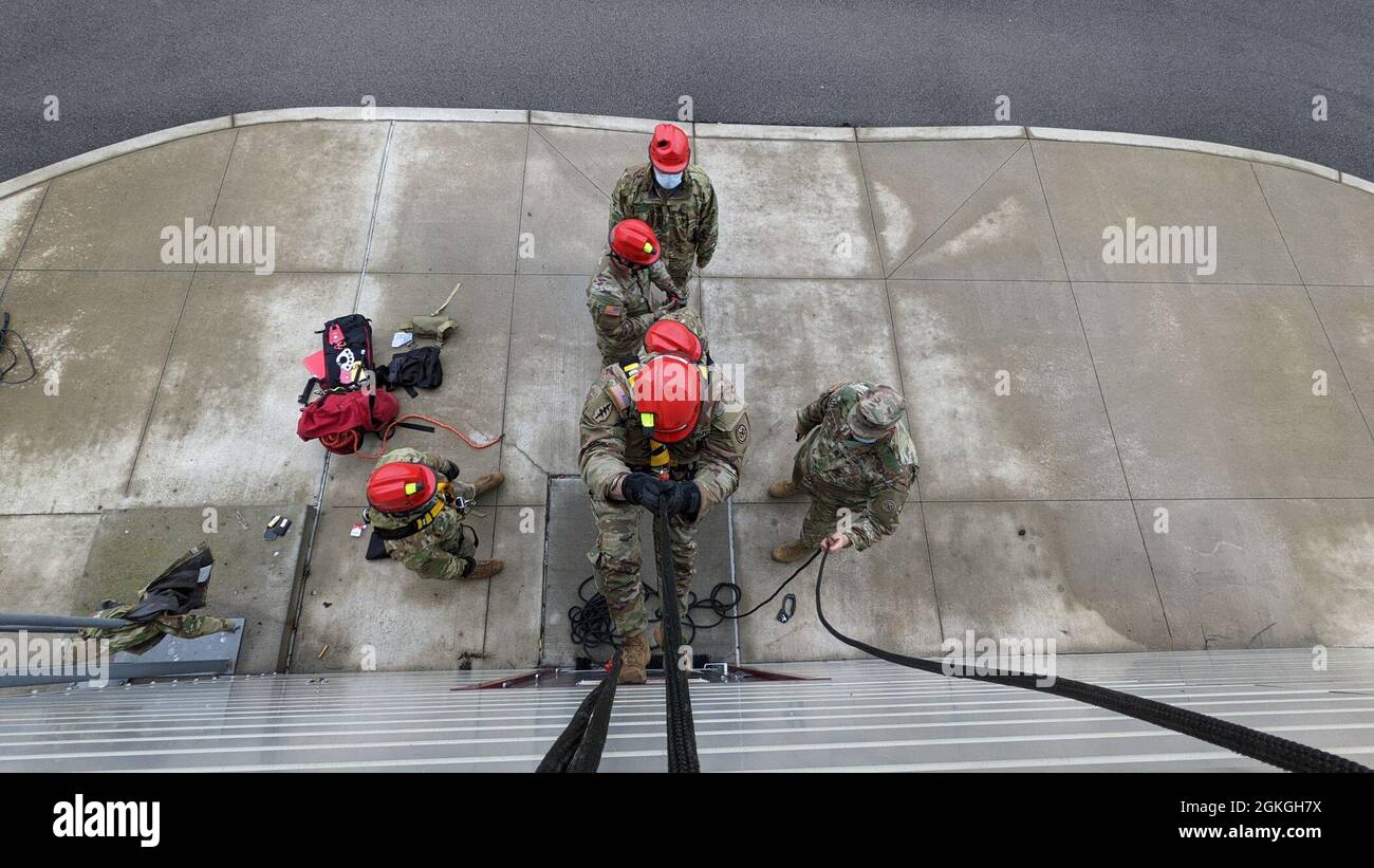 Soldiers assigned to Bravo Company, 152nd Brigade Engineer Battalion of the New York Army National Guard, practice ascending the side of a building during a Homeland Response Force collective training exercise in East Amherst, New York on April 16. Bravo Company is assigned to the FEMA Region II HRF's search and extraction element, tasked with rescuing victims during natural and manmade disasters. Stock Photo