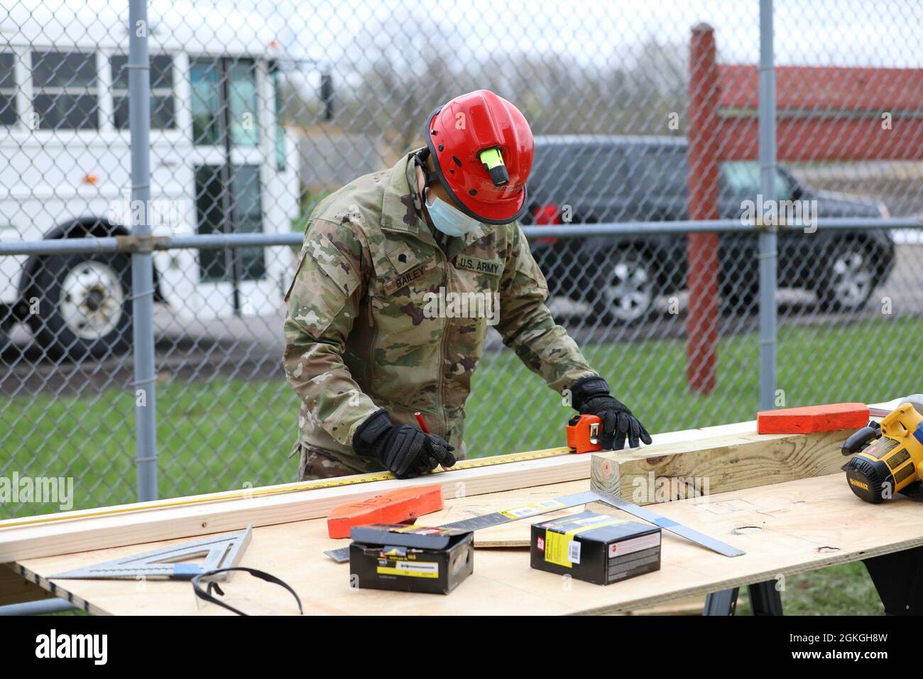 Spc. Jacob Bailey, a combat engineer assigned to Bravo Company, 152nd Brigade Engineer Battalion of the New York Army National Guard, measures materials for shoring exercises during a Homeland Response Force collective training event in East Amherst, New York on April 16. Jacob's unit is assigned as the search and extraction element of the FEMA Region II HRF's CBRN Task Force. Stock Photo
