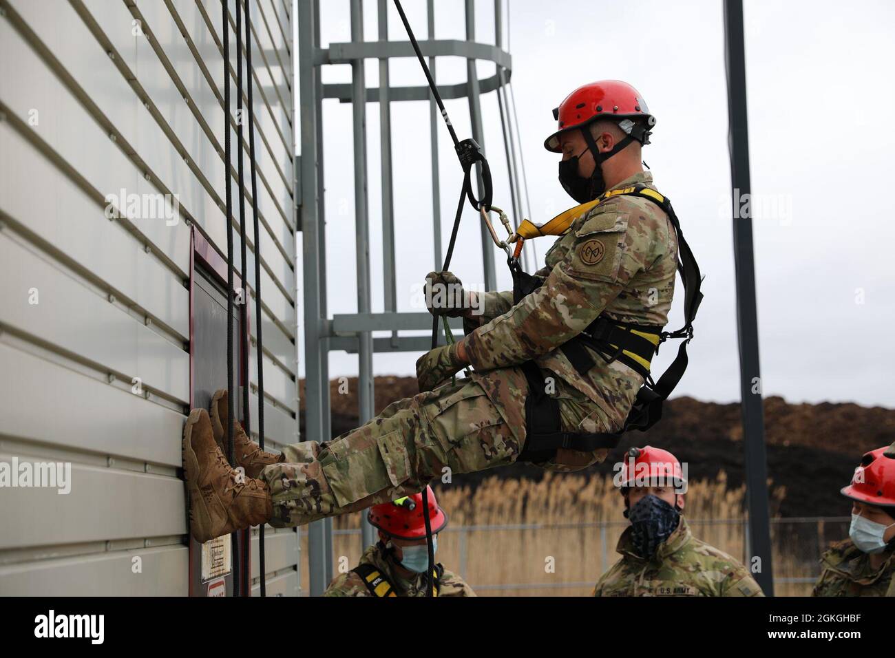 Staff Sgt. Joshua Kaczmarek, a combat engineer assigned to Bravo Company, 152nd Brigade Engineer Battalion of the New York Army National Guard, practices ascending a building by rope during a Homeland Response Force collective training extercise in East Amherst, New York on April 16. Kaczmarek is assigned to the search and extraction element of the FEMA Region II Homeland Response Force. Stock Photo