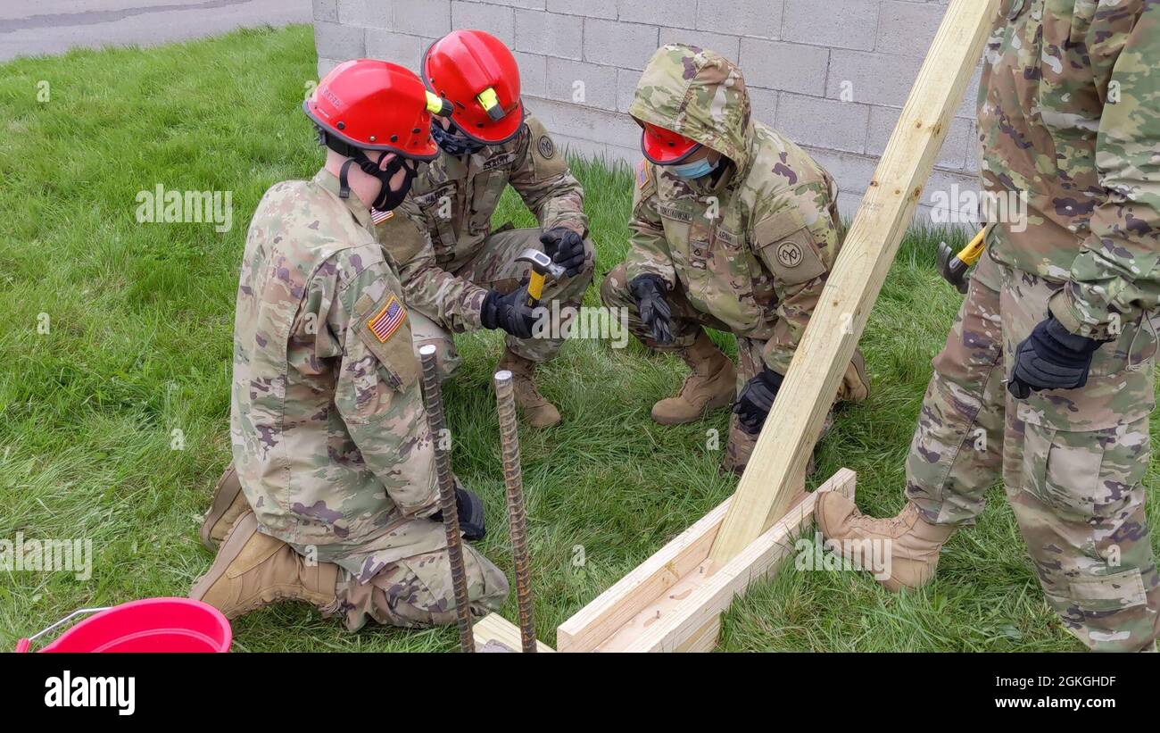 Soldiers assigned to Bravo Company, 152nd Brigade Engineer Battalion of the New York Army National Guard, practice shoring techniques during a Homeland Response Force collective training exercise in East Amherst, New York on April 16. Bravo Company is assigned to the FEMA Region II HRF's search and extraction element, tasked with rescuing victims during natural and manmade disasters. Stock Photo