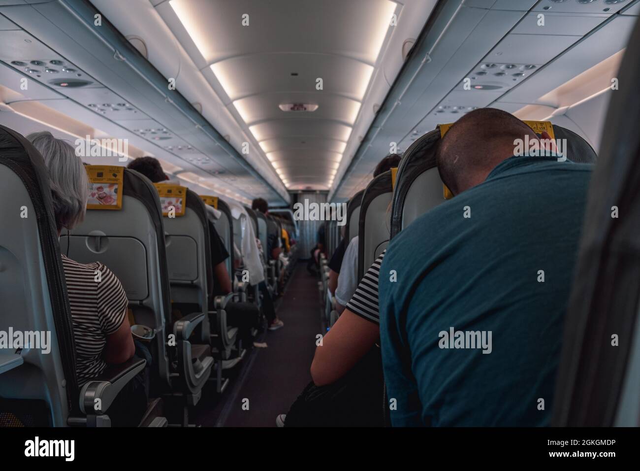 People sleeping on an airplane stock photo alamy