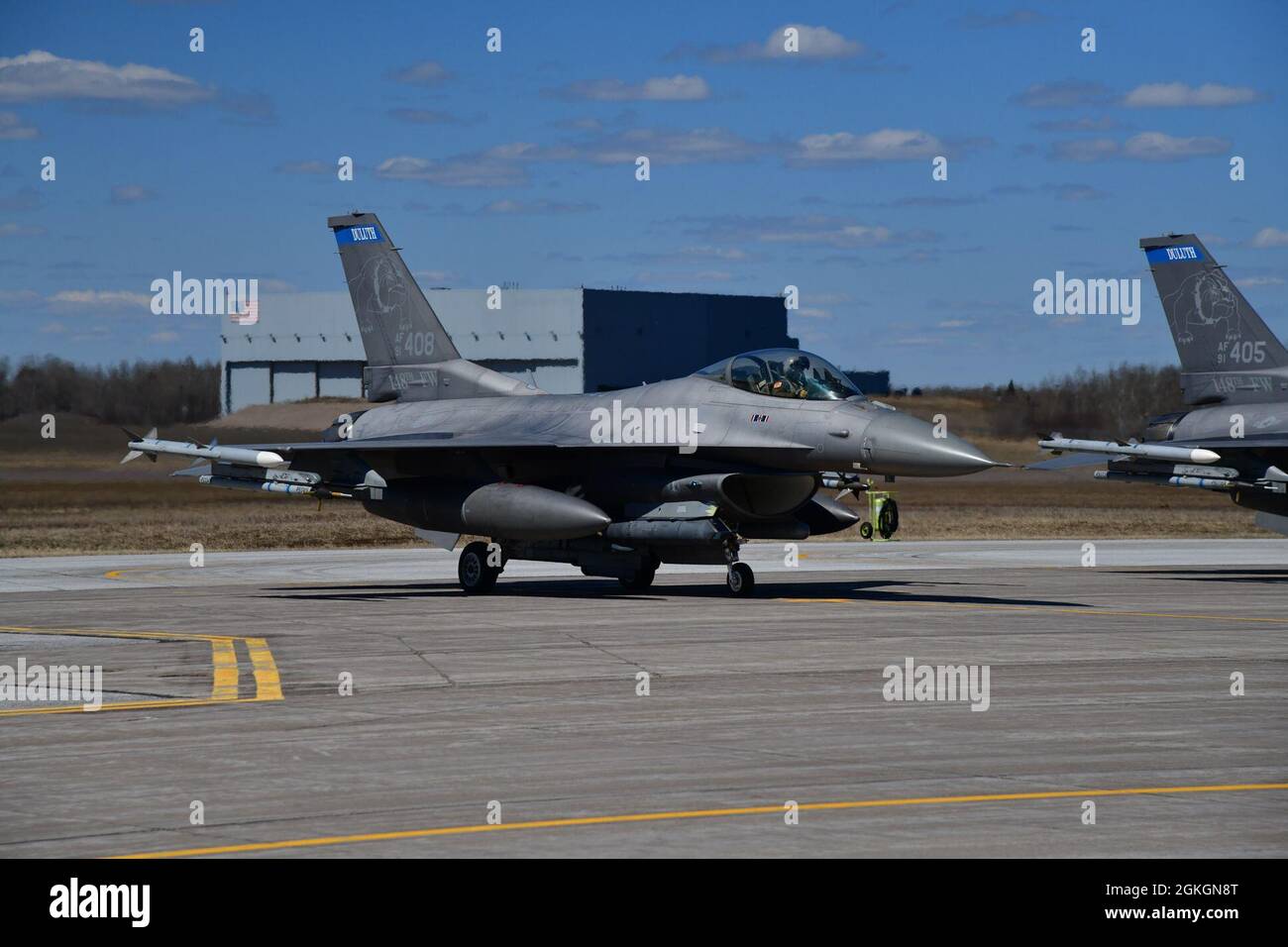 An F-16 Fighting Falcon of the 148th Fighter Wing stands ready to taxi from an End of Runway (EOR) inspection to the runway at the Duluth, Minn. Air National Guard Base April 17, 2021. EOR provides a final inspection of the aircraft prior to take off. Stock Photo