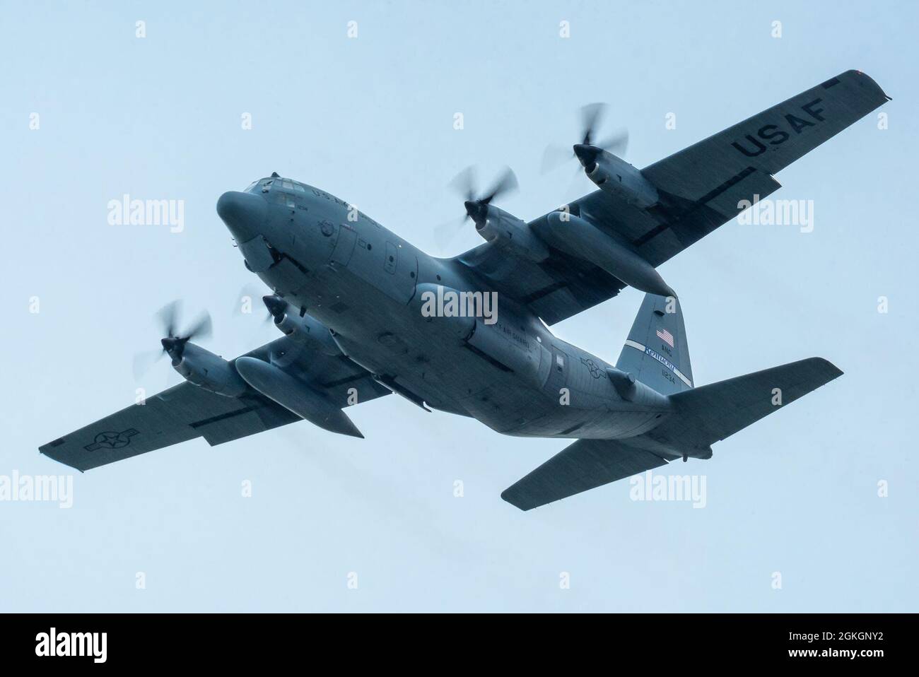 A Kentucky Air National Guard C-130 Hercules from the 123rd Airlift Wing performs an aerial demonstration over Bowman Field in Louisville, Ky., April 17, 2021, as part of a three-ship formation during the Thunder Over Louisville air show. The annual event featured more than 20 military and civilian air craft this year. Stock Photo