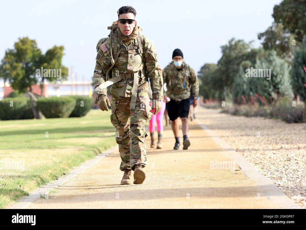 Command Sgt. Maj. Randy Randolph, the senior enlisted advisor of the 24th Theater Public Affairs Support Element, 1st Armored Division, walks toward the end of a first lap during a Bataan Death March on Fort Bliss, Texas, April 17, 2021. The march was in honor of the American and Filipino prisoners of war in the history of the Bataan Death March. The distance for the event was 26 miles, and Soldiers participated in the march with their families. Stock Photo