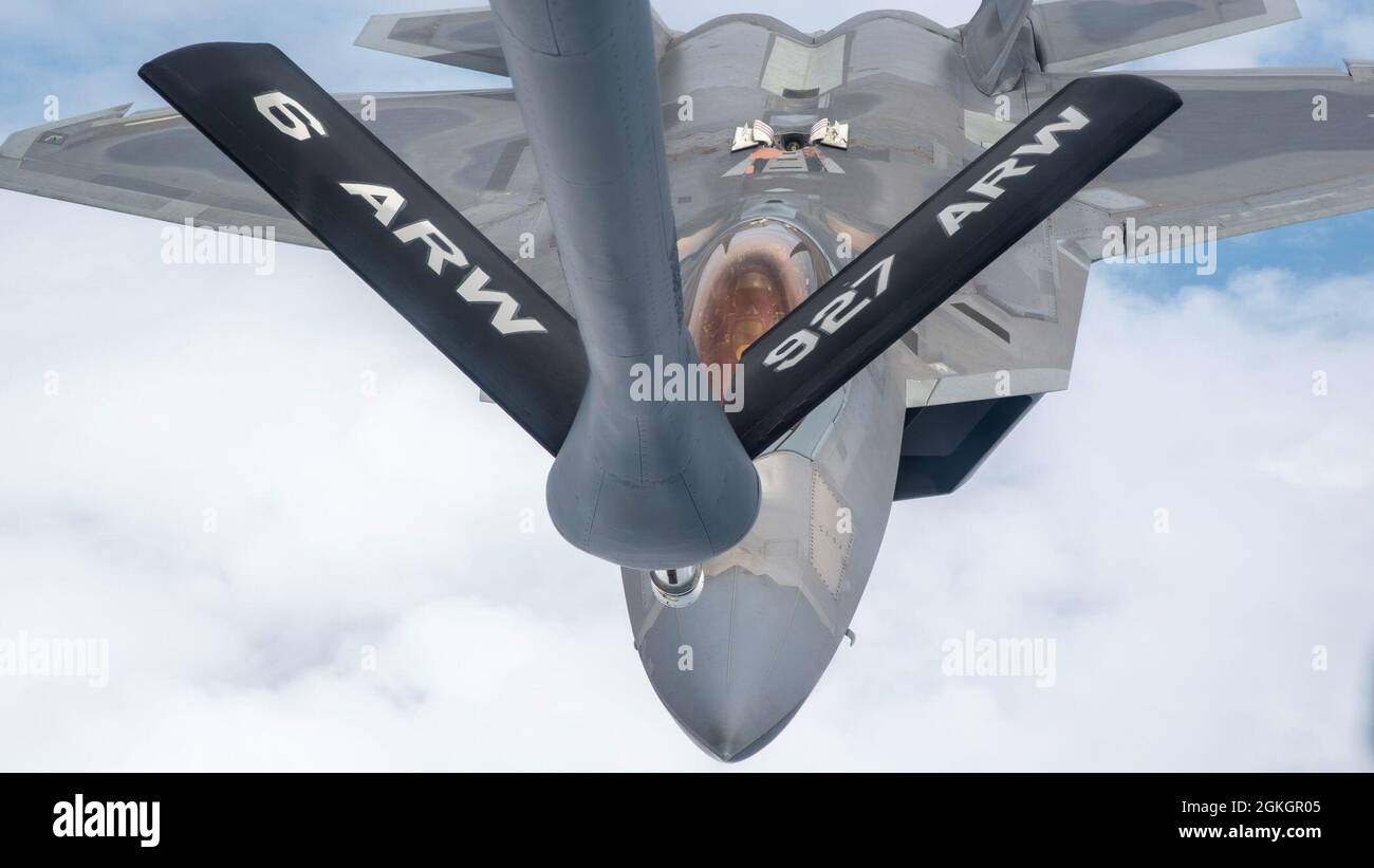 U.S. Air Force Maj. Joshua “Cabo” Gunderson, F-22 Raptor Demonstration Team commander, prepares to receive fuel from a MacDill Air Force Base, Fla., KC-135 Stratotanker, April 17, 2021. Gunderson, a Tampa native, rendezvoused with the KC-135 assigned to the 50th Air Refueling Squadron in-between performances for the SUN ‘n FUN airshow in Lakeland, Fla. Stock Photo