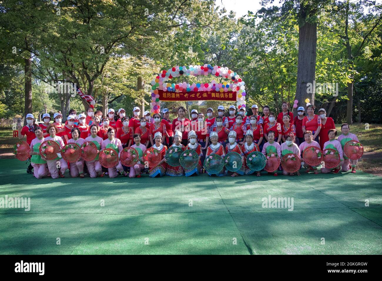 A group photo of the members of Kai Xin Yizhu dance troupe prior to a performance celebrating their 6th anniversary. In Queens, New York. Stock Photo