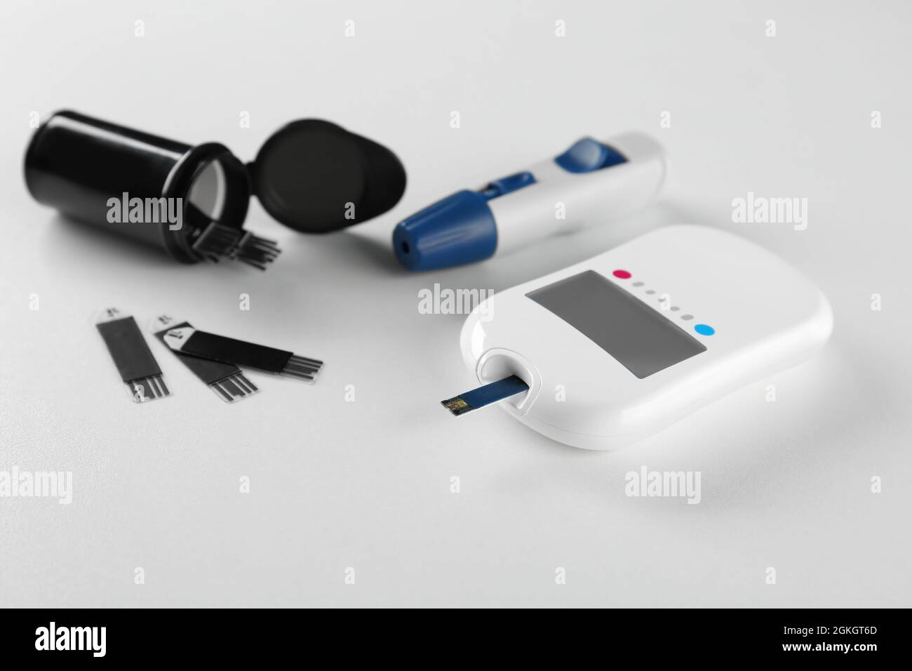 Composition with digital glucometer on white background. Diabetes
