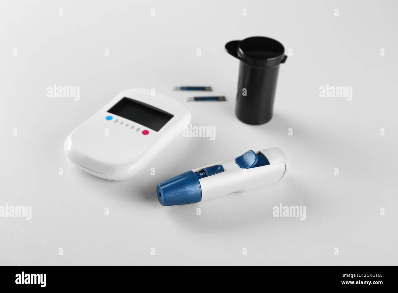 Composition with digital glucometer on white background. Diabetes