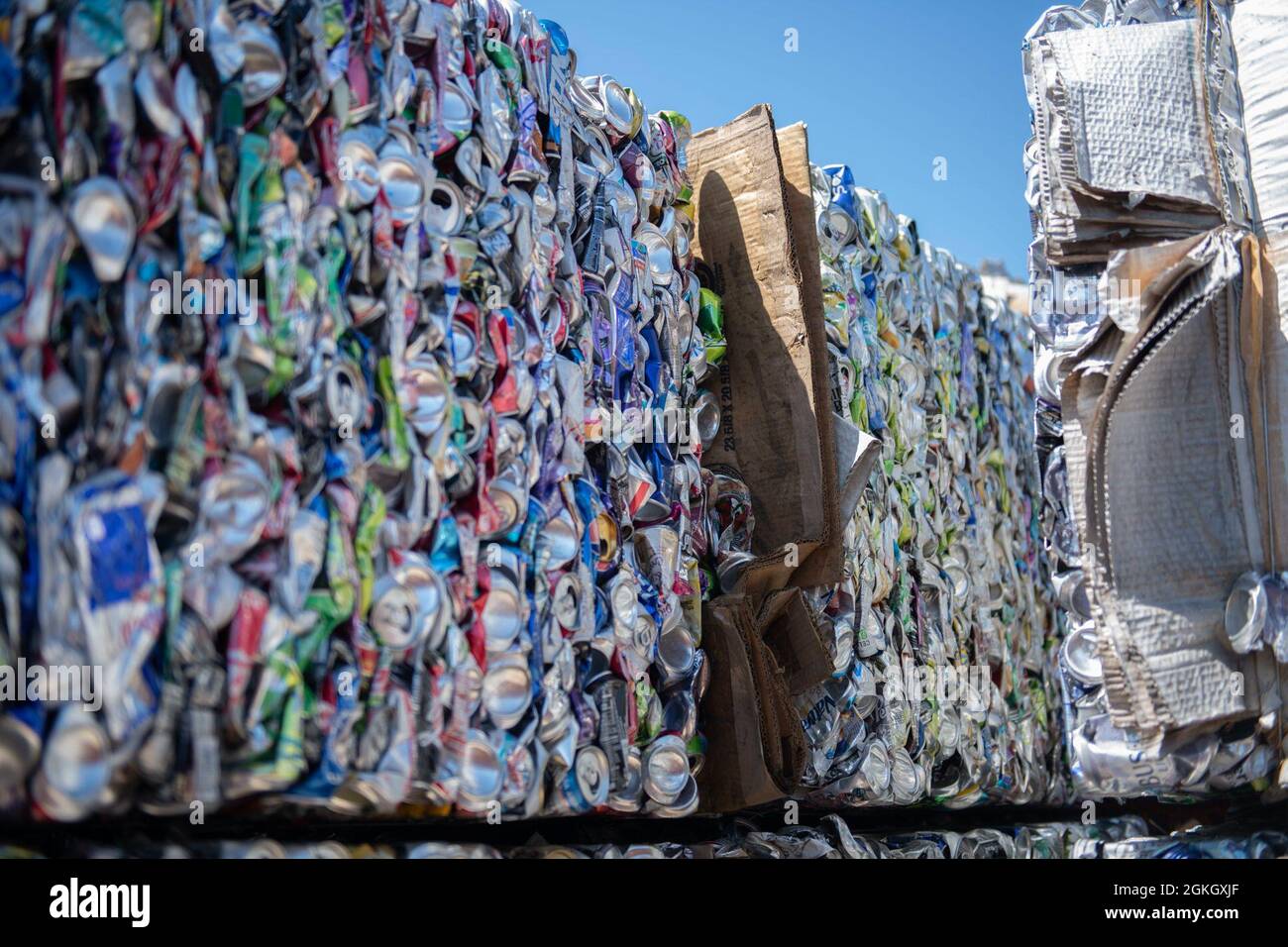 Pictured are stacks of crushed aluminum cans waiting to be recycled at Tyndall Air Force Base, Florida, April 19, 2021. The recycling center at Tyndall collects and distributes recyclable materials to various recycling brokers in the community in attempt to reduce the amount of solid waste being put into local landfills. Stock Photo