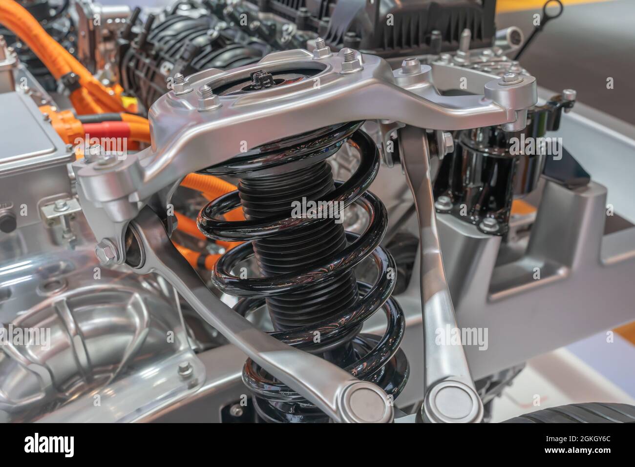Detailed closeup of an electric car shock absorber system and engine ...