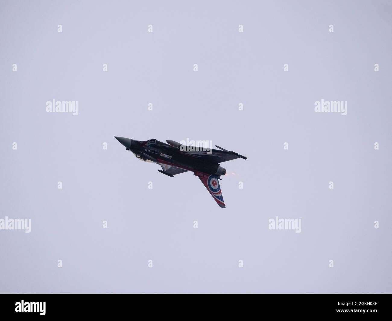 RAF Typhoon fighter jet in Black Jack colours inverted during a display at the 2021 Bournemouth Air Display. Stock Photo