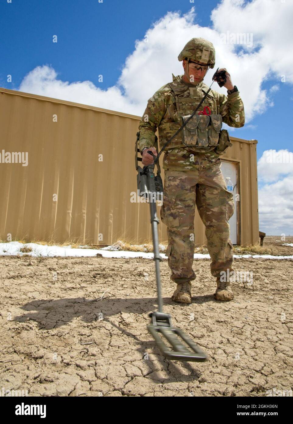 Staff Sgt. John Olivas, 79th EOD Bn., 704th EOD Co. sweeps for simulated mines during the 2021 EOD Team of the Year competition. The competition at Pinion Canyon Maneuver Site, Colorado included twelve of the best EOD teams, representing three battalions, 11 bases, and eight states. Stock Photo