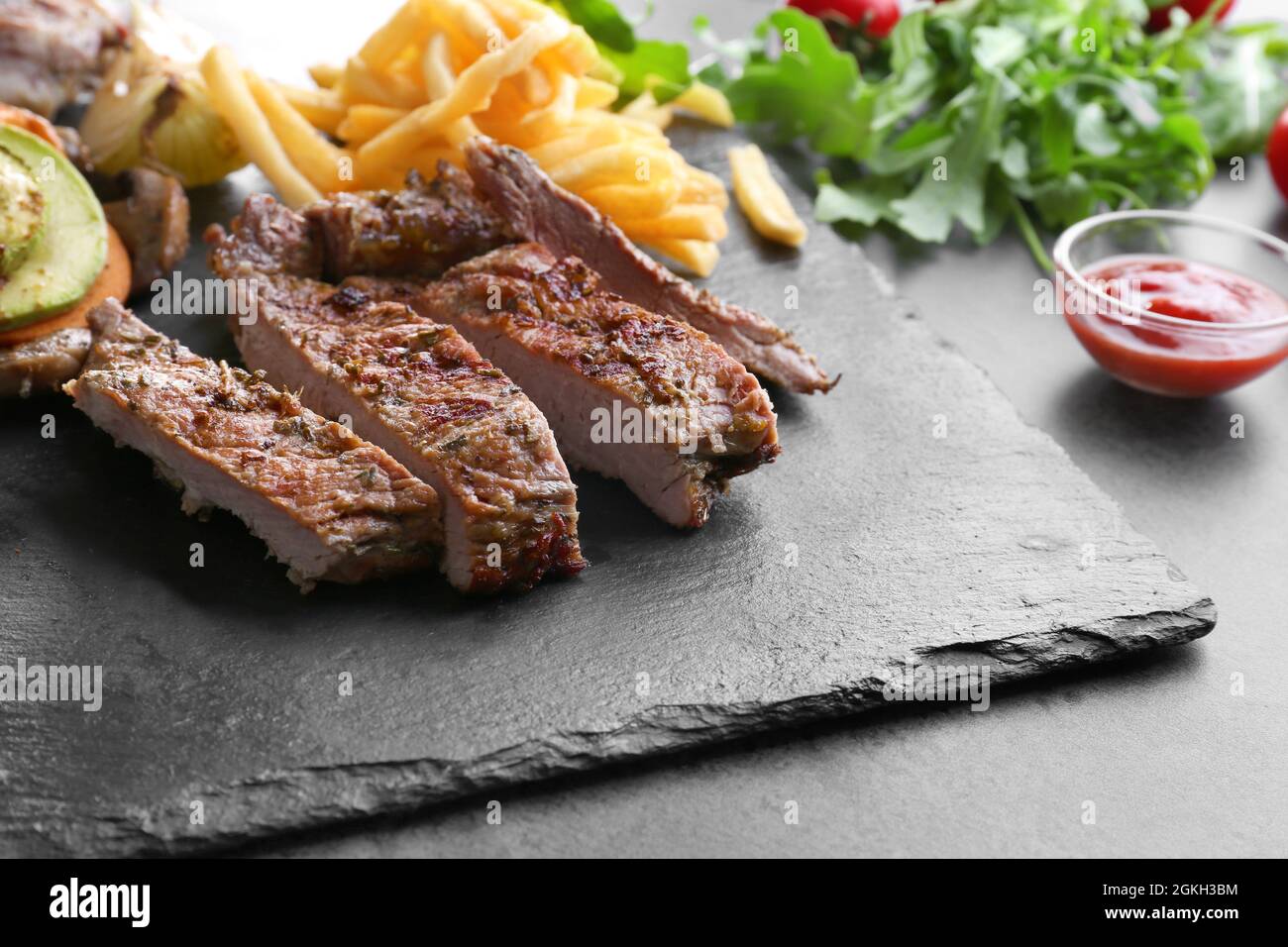 Delicious grilled steak frites on slate plate Stock Photo Alamy