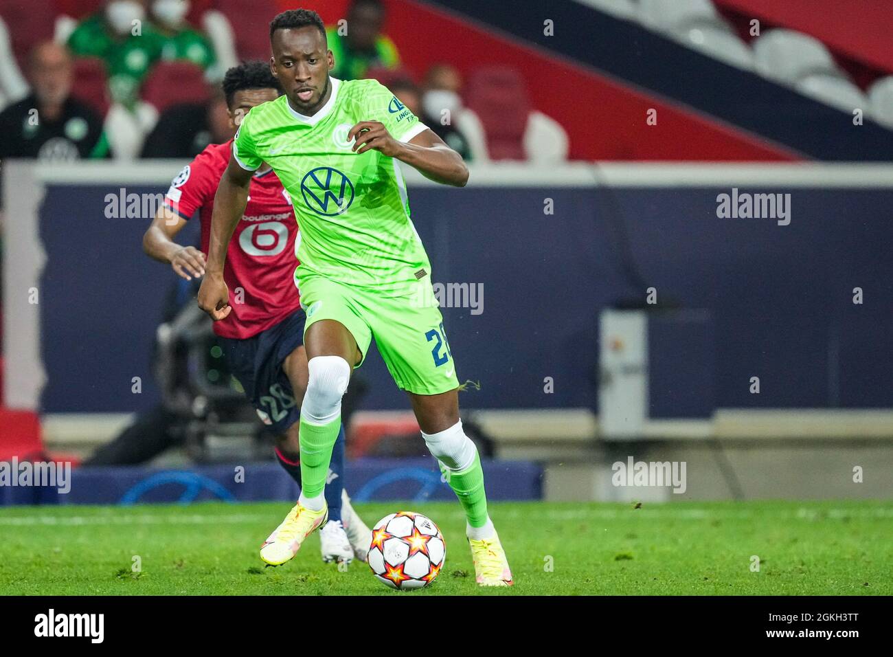 LILLE, FRANCE - SEPTEMBER 14: Dodi Lukebaklo of VfL Wolfsburg and Angel Gomes of LOSC Lille during the UEFA Champions League match between LOSC Lille and VfL Wolfsburg at Stade Pierre-Mauroy on