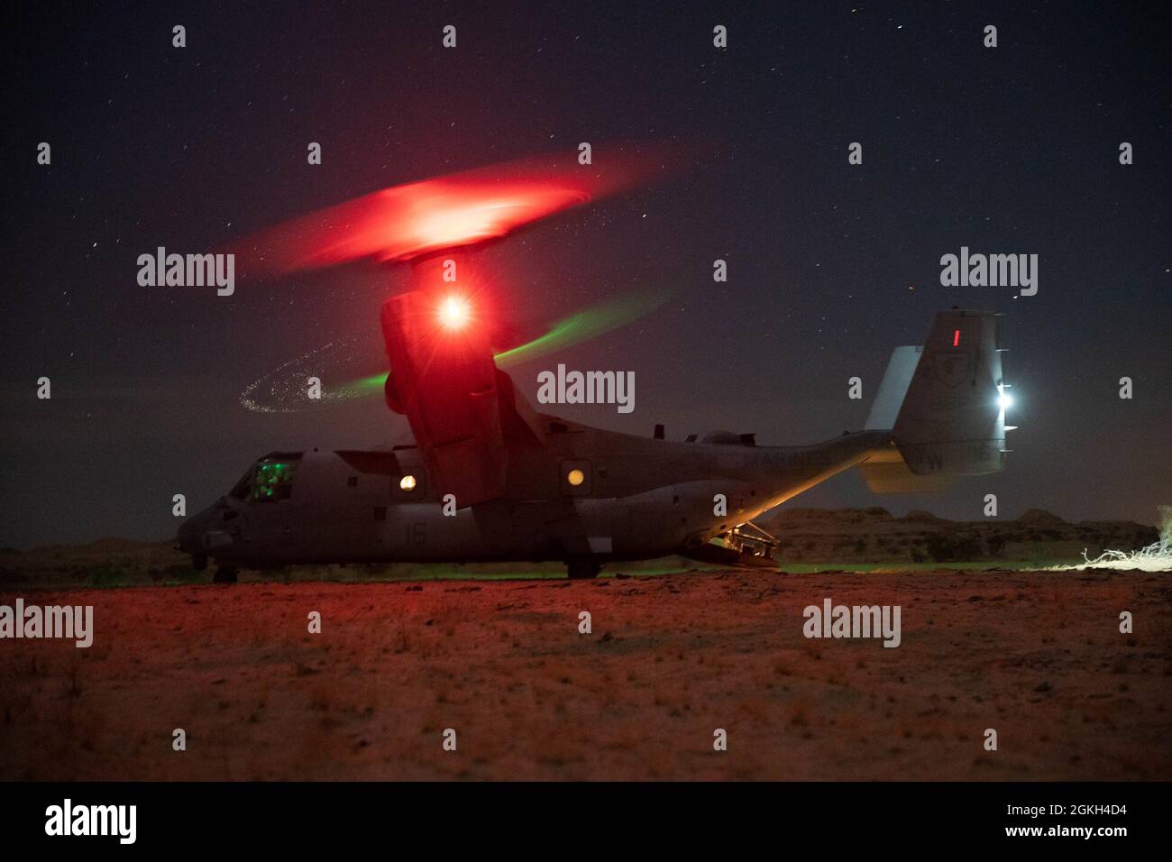 EL CENTRO, Calif. (April 20, 2021) An MV-22B Osprey with Marine Medium Tiltrotor Squadron (VMM) 165 (Reinforced), 11th Marine Expeditionary Unit, prepares to transport Marines with Bravo Company, Battalion Landing Team 1/1, 11th MEU, during a tactical recovery of aircraft and personnel exercise, April 20. The 11th MEU is conducting routine operations with the Essex Amphibious Ready Group (ARG) while underway in U.S. Third Fleet. Together, the 11th MEU, Amphibious Squadron (PHIBRON) 1, and ships are designated as an ARG. Stock Photo