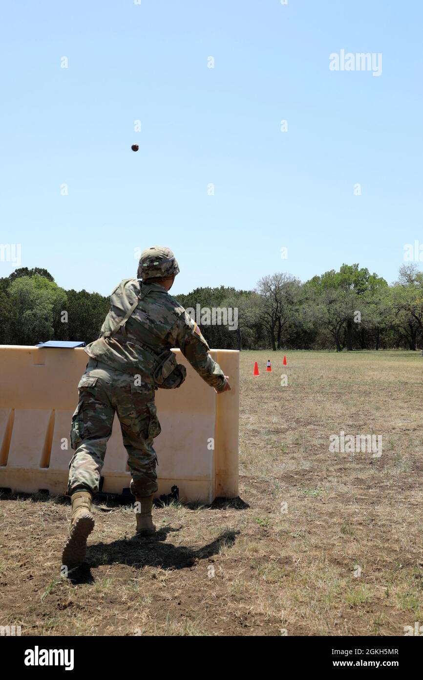 Sgt. Avery Tobar, Headquarters and Headquarters Command, 505th Military Intelligence Brigade, throws an inert grenade during the grenade toss event of the Military Intelligence Readiness Command (MIRC) Best Warrior Competition (BWC) at Joint Base San Antonio – Camp Bullis April 21, 2021. Events such as this test the competitors’ capabilities and combat-readiness and help determine which Soldier will be named the MIRC’s Best Warrior. Stock Photo