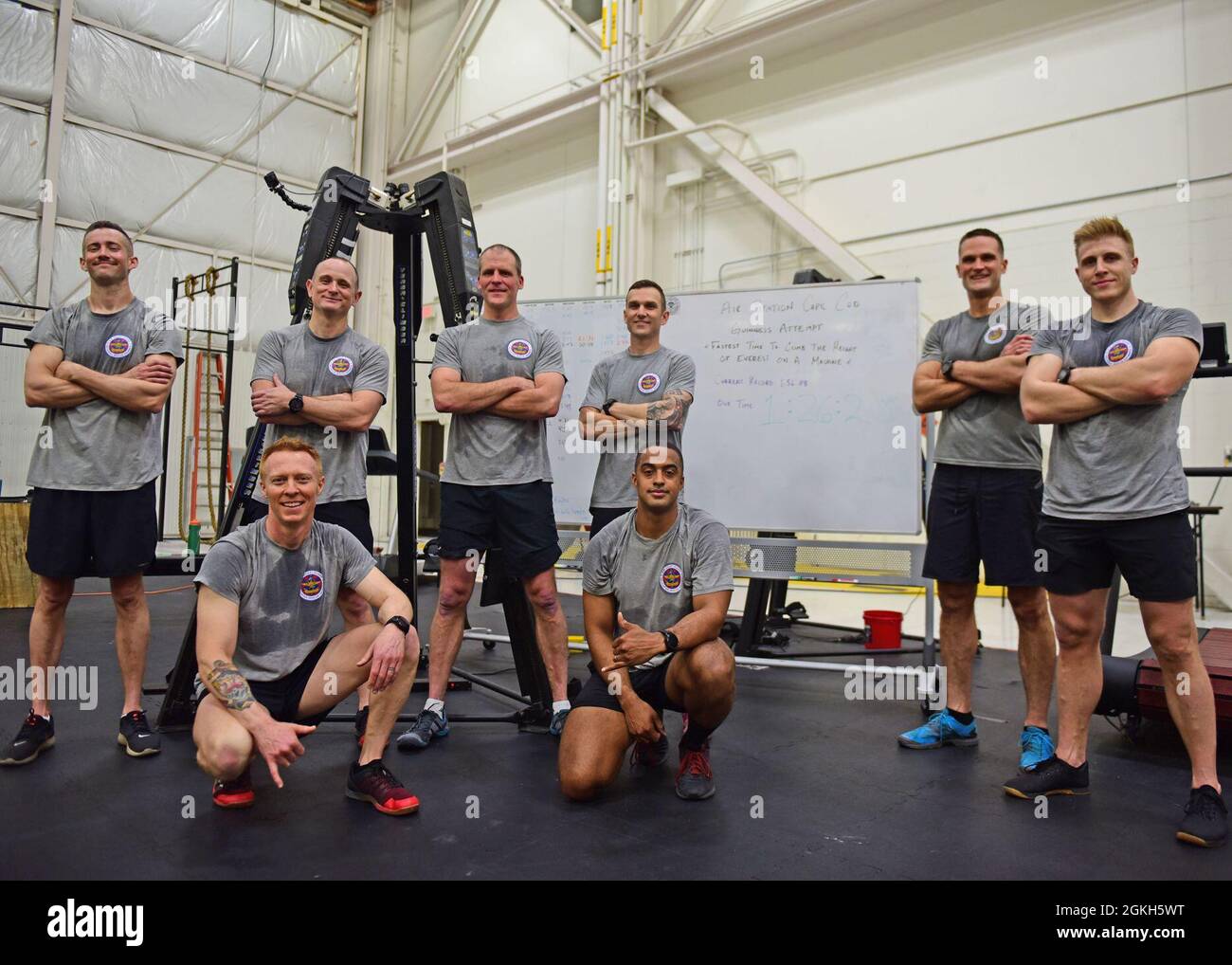 Eight Coast Guard rescue swimmers beat the Guinness World Record for climbing the 29,028 ft