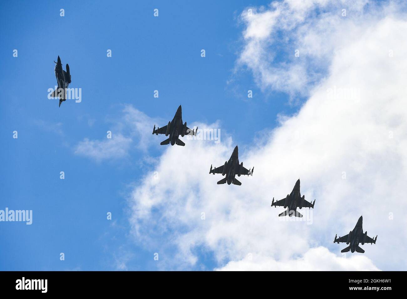 Aircraft from multiple countries participating in INIOCHOS 21 fly in a formation over Andravida Air Base, Greece, April 21, 2021. Participation in INIOCHOS 21 helps U.S. Air Force pilots develop and improve air readiness and interoperability with allied and partner air forces. Stock Photo