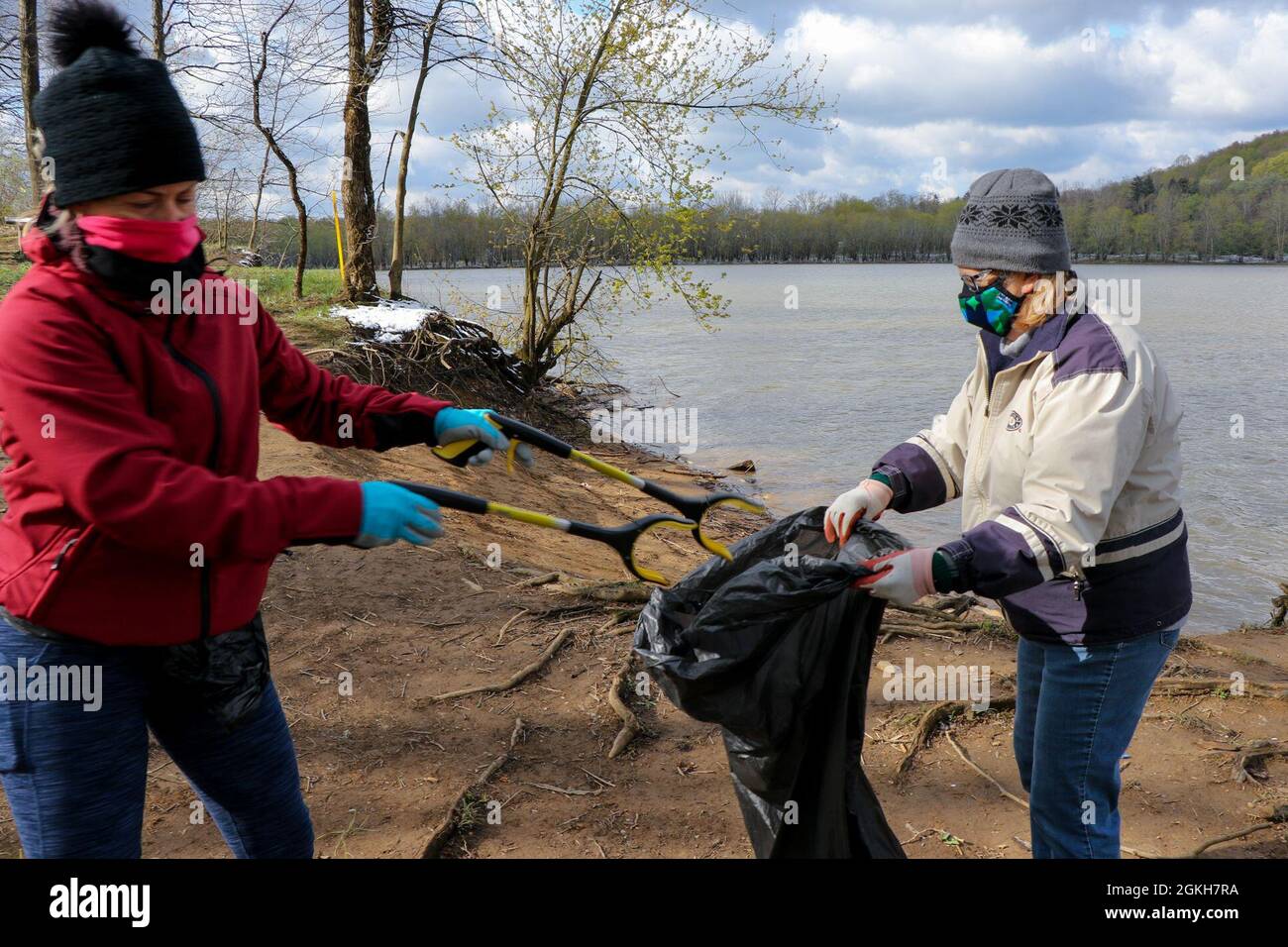 A mother and daughter volunteer to clean up around Loyalhanna Lake for