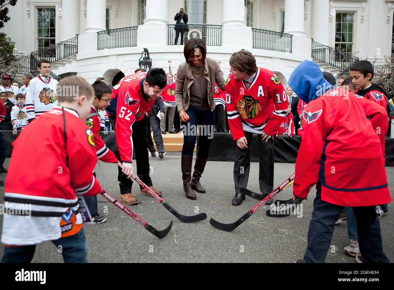 First Lady Michelle Obama participates in a 'Let's Move!' and NHL partnership event with Chicago Blackhawks and Washington Capitals players on the South Lawn of the White House, March 11, 2011.  (Official White House Photo by Samantha Appleton) This official White House photograph is being made available only for publication by news organizations and/or for personal use printing by the subject(s) of the photograph. The photograph may not be manipulated in any way and may not be used in commercial or political materials, advertisements, emails, products, promotions that in any way suggests appr Stock Photo