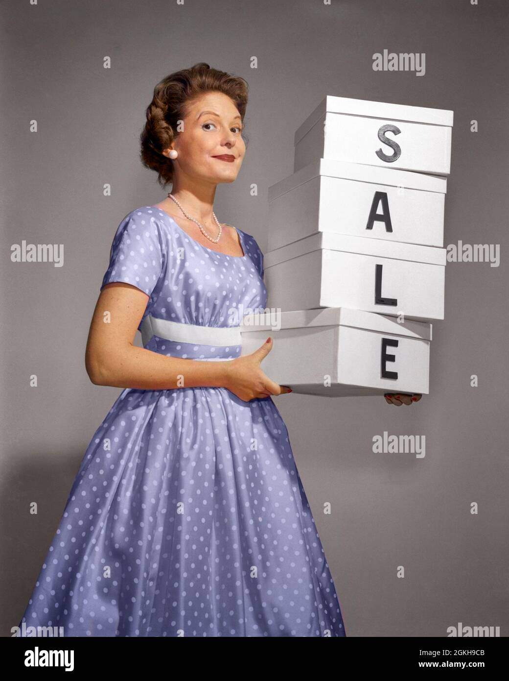 1960s WOMAN IN POLKA-DOT DRESS LOOKING AT CAMERA HOLDING A STACK OF 4 BOXES WITH ONE CHARACTER CENTERED ON EACH SPELLING SALE - g4967c DEB001 HARS NOSTALGIA BOXES OLD FASHION 1 JUVENILE STYLE WELCOME COMMUNICATION SPELLING ADVERTISING BALANCE INFORMATION LIFESTYLE FEMALES HEADS STUDIO SHOT PEOPLE CHILDREN HALF-LENGTH LADIES PERSONS CHARACTER CONFIDENCE BALANCING EYE CONTACT DOT FREEDOM GOALS SUCCESS POLKA CUSTOMER SERVICE CHOICE EXCITEMENT INNOVATION POLKA DOTS POLKA-DOT OCCUPATIONS SMILES POLKA-DOTS CONNECTION POLKA-DOTTED POLKA DOT SPELL STYLISH SUPPORT DEB001 CENTERED DOTS PROMOTING Stock Photo