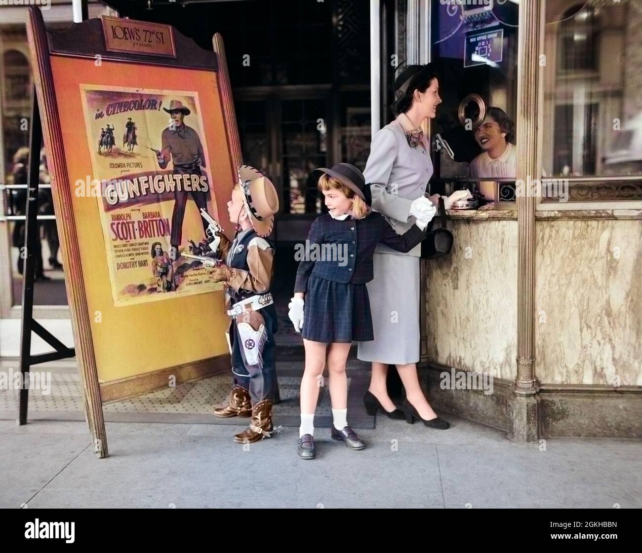1950s MOTHER 2 CHILDREN BUYING TICKETS TO MOVIE MATINEE BOY WEARING COWBOY COSTUME - j5858c DEB001 HARS OUTDOOR COWBOY TOGETHER COSTUME 3 MOVIE PICTURE MOM CLOTHING SHOW CINEMA POSTER NOSTALGIC FILM PAIR GLOVE SUBURBAN URBAN THEATER RELATIONSHIP MOTHERS OLD TIME NOSTALGIA BROTHER MOVING SHOOTING OLD FASHION SISTER 1 JUVENILE STYLE COMMUNICATION CASHIER GUNS BILLBOARD WEST SONS TICKETS LIFESTYLE PARENTING FEMALES TICKET BROTHERS RELATION GROWNUP COPY SPACE PEOPLE CHILDREN FRIENDSHIP FULL-LENGTH LADIES SHOOT DAUGHTERS PERSONS INSPIRATION GROWN-UP CHARACTER MALES WESTERN ENTERTAINMENT SIBLINGS Stock Photo