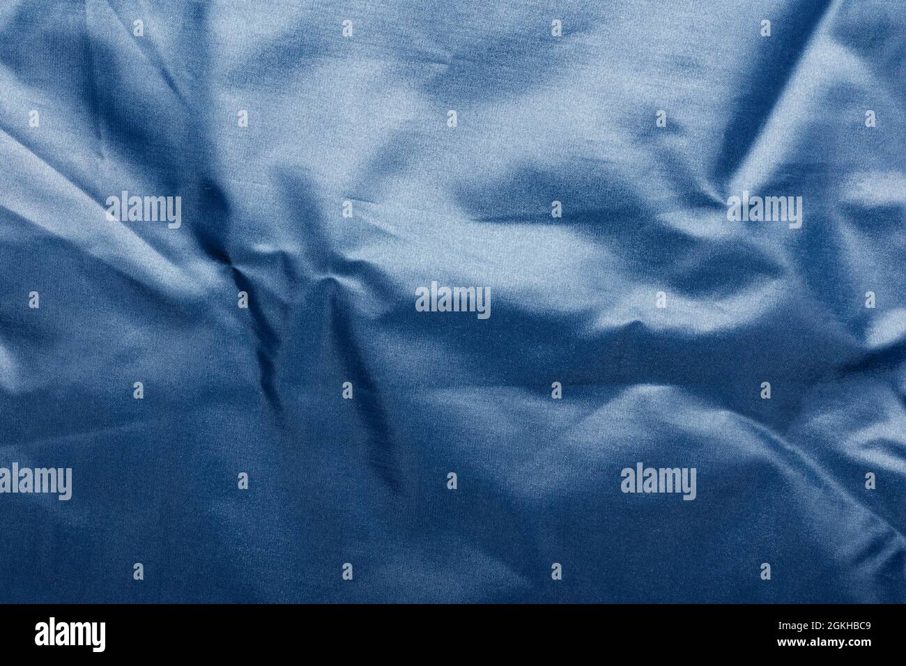 Texture backdrop photo of blue colored and folded bologna fabric Stock