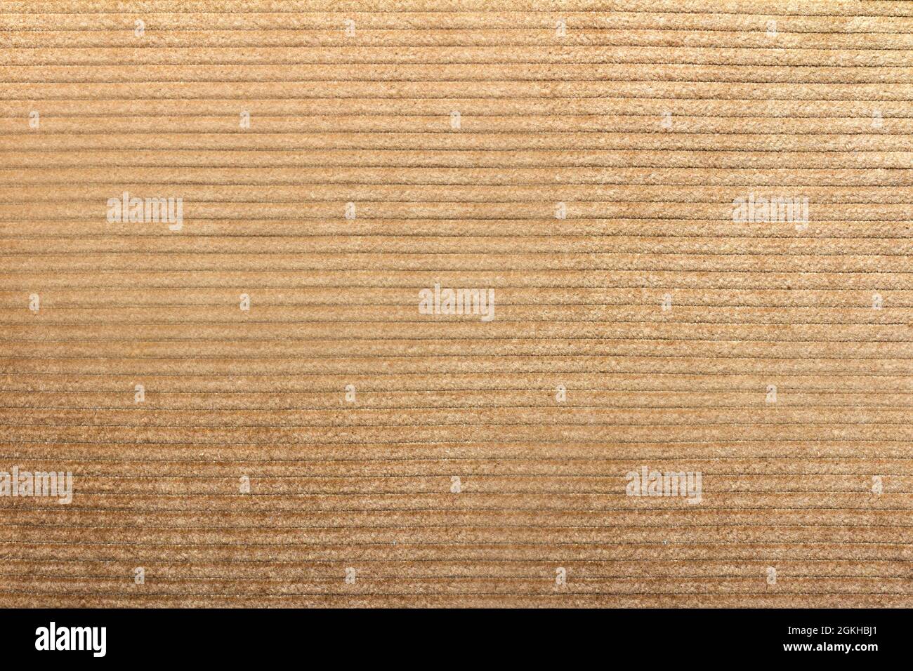 Texture backdrop photo of beige colored corduroy fabric cloth. Stock Photo