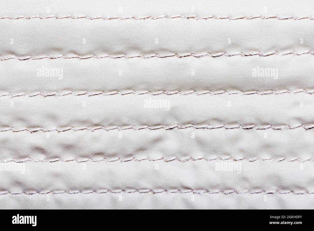 Bologna fabric seamed texture surface, white colored material Stock