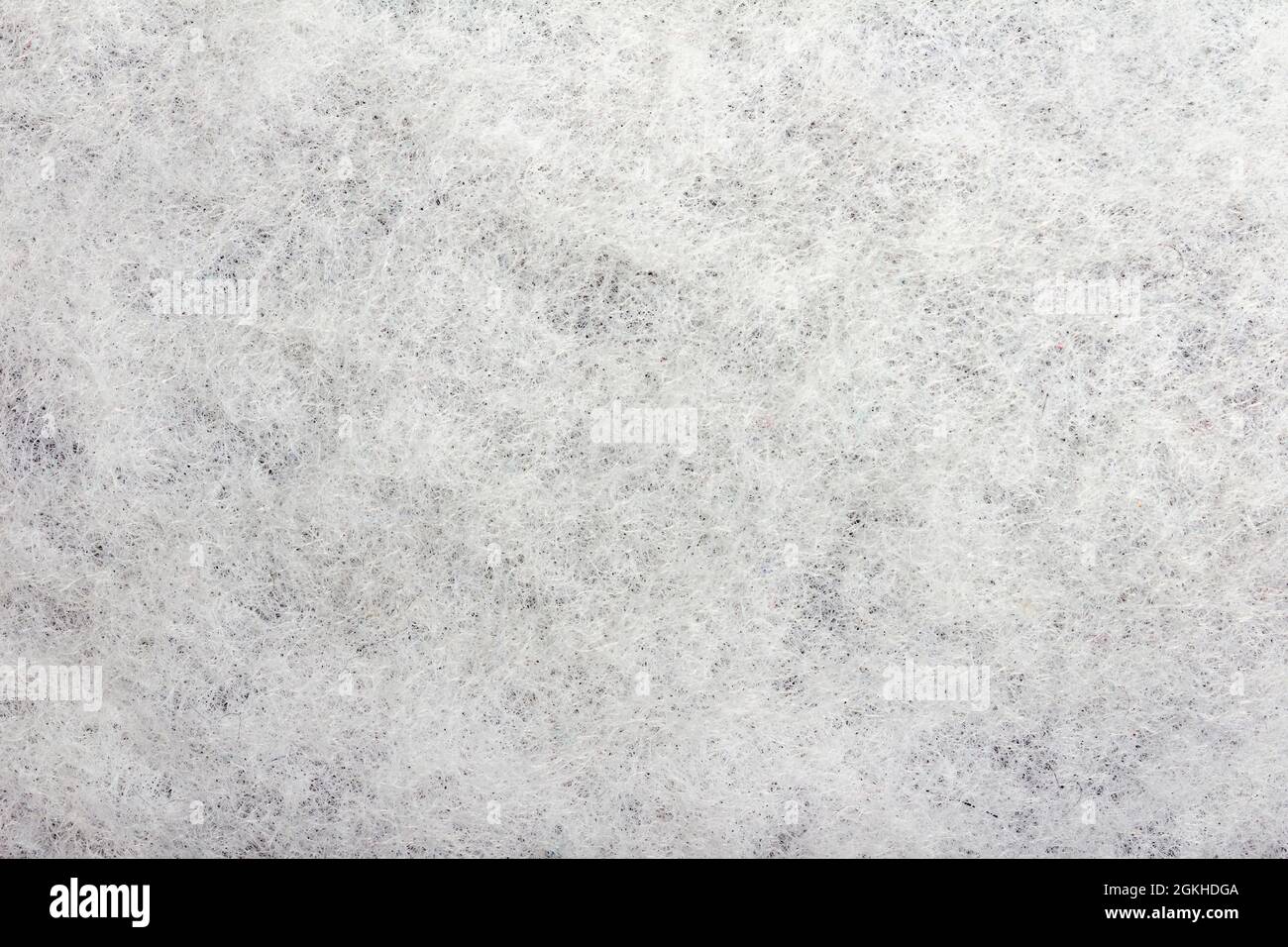 Texture backdrop photo of white colored sintepon fibers material. Stock Photo