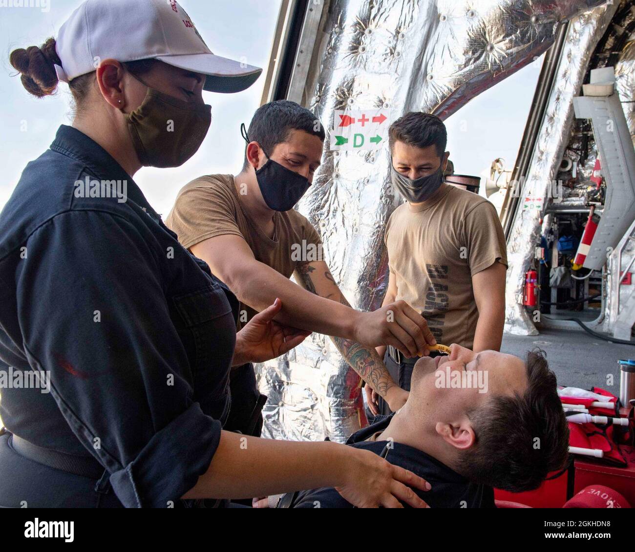 PACIFIC OCEAN (April 23, 2021) Sailors practice inserting a nasal pharyngeal airway during a medical training evolution aboard Independence-variant littoral combat ship USS Charleston (LCS 18), April 23. Charleston is currently operating in U.S. 3rd Fleet. Stock Photo