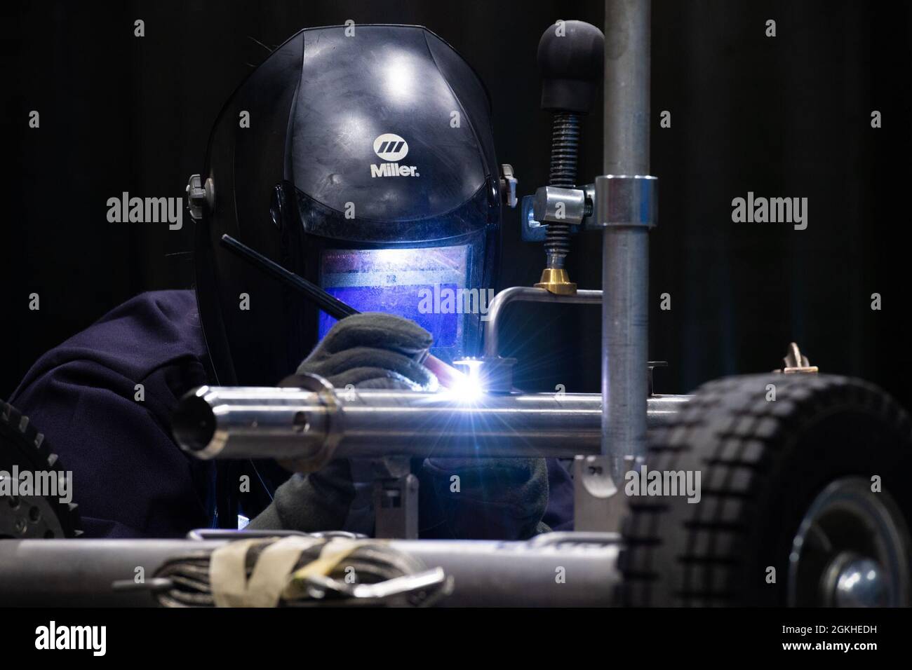 Senior Airman Jamee Hines, 56th Equipment Maintenance Squadron aircraft metals technology journeyman, welds pieces to a modified egress seat dolly stem, April 22, 2021, at Luke Air Force Base, Arizona. The aircraft metals technology section reinforces various parts for aircraft and maintenance equipment. The 56th EMS provides safe and reliable aircraft, equipment, munitions and maintenance to ensure Luke AFB can continue to train the world’s greatest fighter pilots. Stock Photo