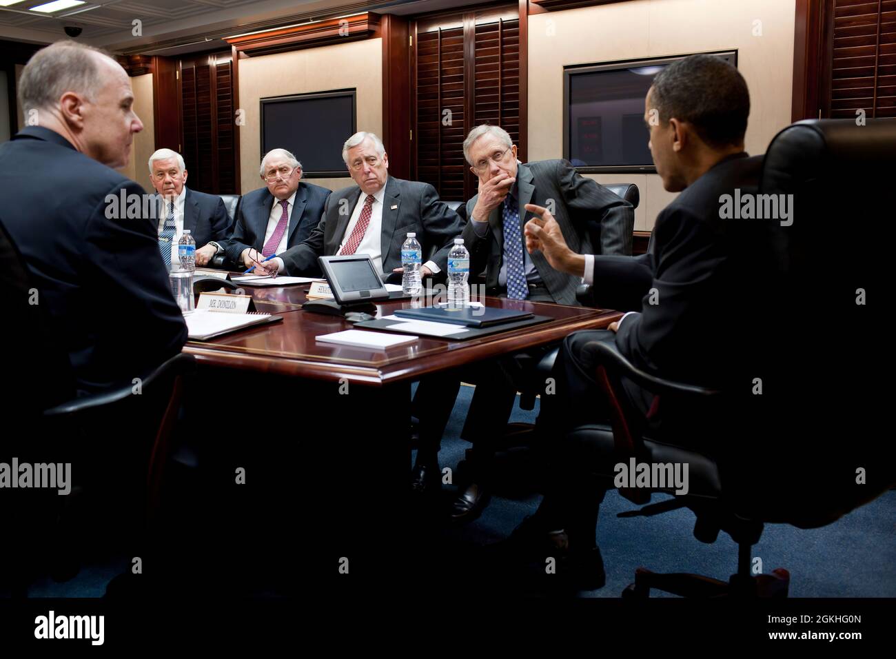 President Barack Obama meets with a bipartisan group of Congressional leaders on Libya in the Situation Room of the White House, March 18, 2011. Seated, from left, are: National Security Advisor Tom Donilon, Sen. Richard Lugar, R-Ind., Sen. Carl Levin, D-Mich., Rep. Steny Hoyer, D-Md., and Senate Majority Leader Harry Reid, D-Nev. (Official White House Photo by Pete Souza) This official White House photograph is being made available only for publication by news organizations and/or for personal use printing by the subject(s) of the photograph. The photograph may not be manipulated in any way a Stock Photo