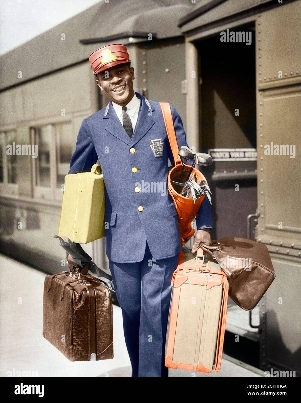voldsom Uganda Bevise 1930s SMILING AFRICAN-AMERICAN MAN RED CAP PORTER CARRYING LUGGAGE IN TRAIN  STATION - r6039c HAR001 HARS EXPRESSION OLD TIME BUSY NOSTALGIA TRAINS  INDUSTRY OLD FASHION 1 FACIAL WELCOME LAUGH CAREER RAILROAD SUITCASES