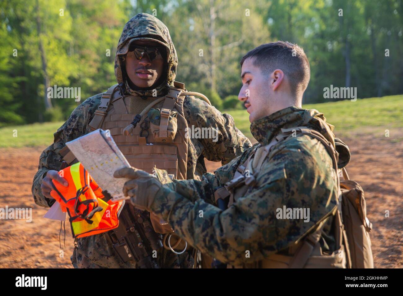U.S. Marine Corps Lance Corporal Anthoney Morris and Corporal Gregory Seraphin, Marine Air-Ground Task Force planning specialists with Headquarters and Service Battalion, U.S. Marine Corps Forces Command, review their land navigation route at Quantico, Virginia, April 23, 2021. During the field training exercise, Marines conducted land navigation and close, long and unknown distance shooting while building squad level operational cohesion. Stock Photo