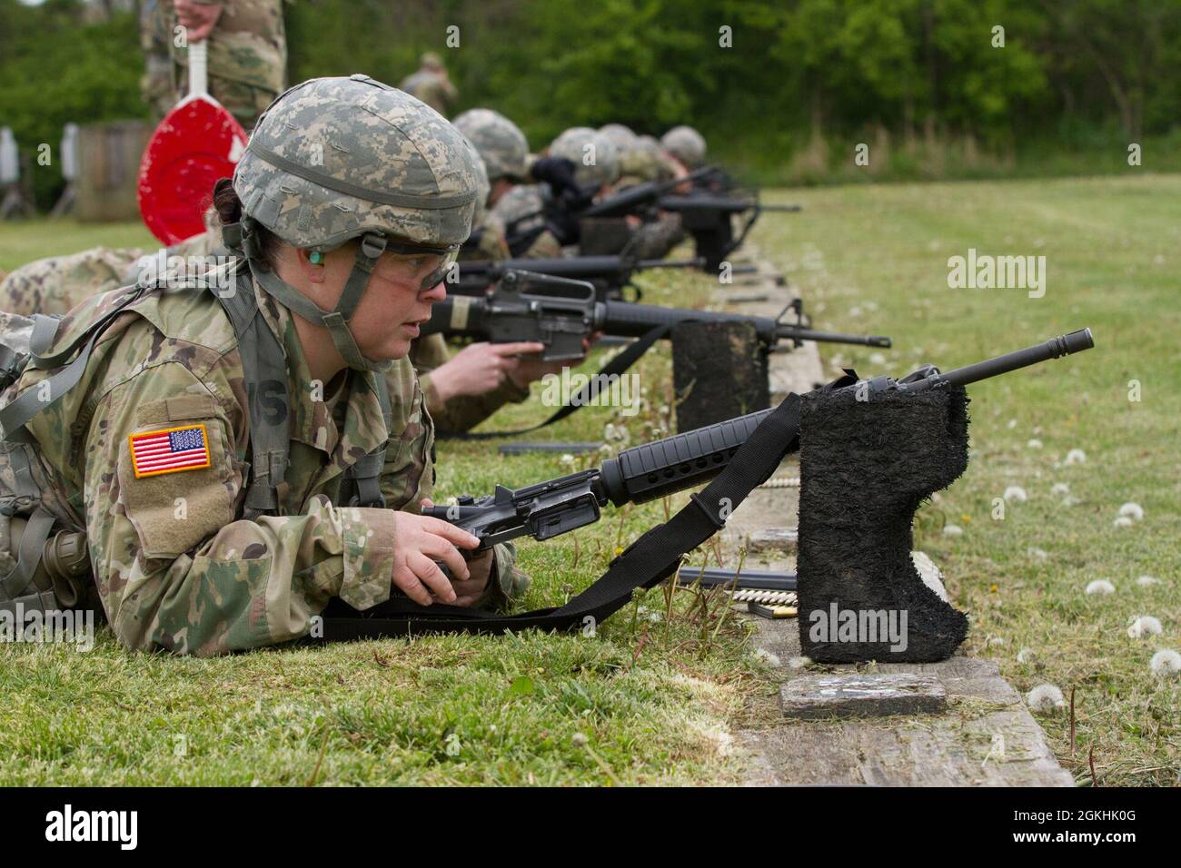 U.S. Army Reserve Soldiers with the 338th Army Band, settle into a supported prone position at Camp Sherman Joint Training Center, Chillcothe, Ohio, April 24, 2021. In order to qualify with the M-16 or M-4 rifle, Soldiers must fire in a prone supported, prone unsupported, and kneeling position. Stock Photo