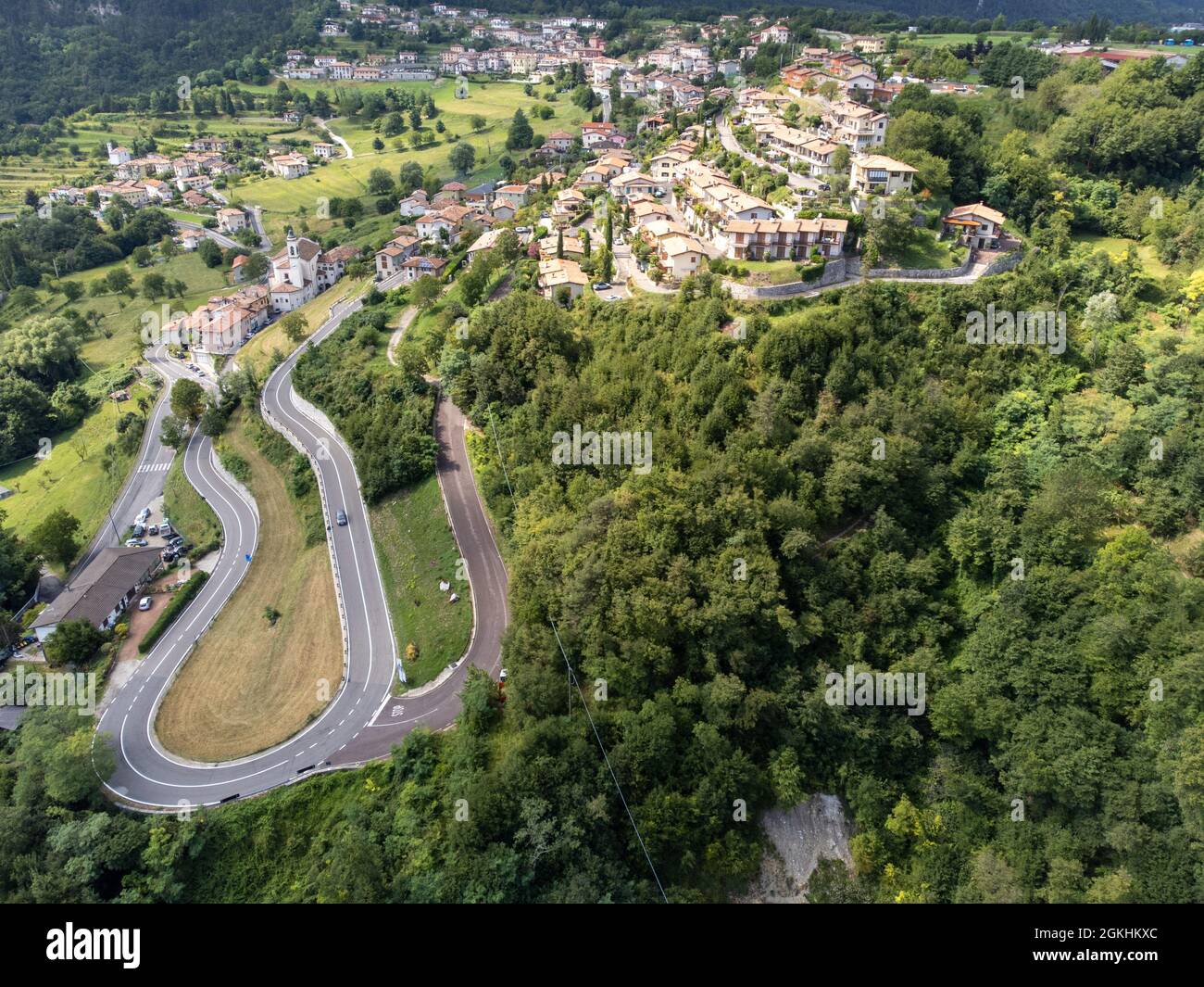 View to a town in green mountains Stock Photo - Alamy