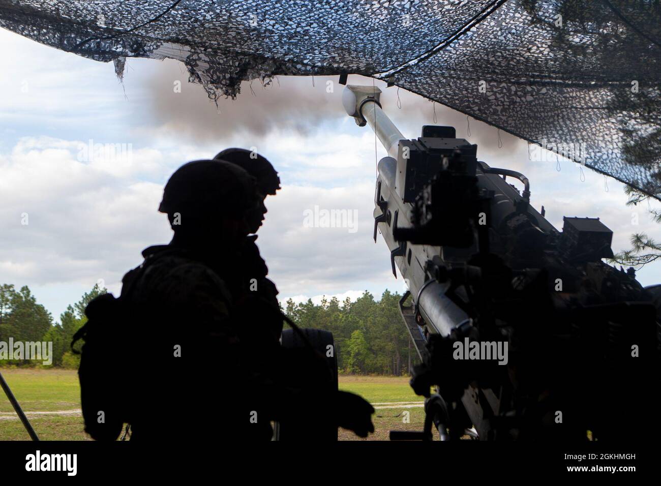 U.S. Marines with 1st Battalion, 10th Marine Regiment, 2d Marine Division (2d MARDIV), fire a M777 Howitzer during Exercise Rolling Thunder 21.2 on Fort Bragg, N.C, April 25, 2021. This exercise is a 10th Marine Regiment-led live-fire artillery event that tests 10th Marines' abilities to operate in a simulated littoral environment against a peer threat in a dynamic and multi-domain scenario. Stock Photo