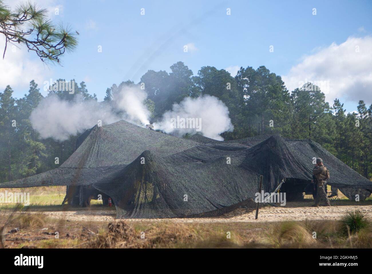 U.S. Marines with 1st Battalion, 10th Marine Regiment, 2d Marine Division (2d MARDIV), fire a M777 Howitzer during Exercise Rolling Thunder 21.2 on Fort Bragg, N.C, April 25, 2021. This exercise is a 10th Marine Regiment-led live-fire artillery event that tests 10th Marines' abilities to operate in a simulated littoral environment against a peer threat in a dynamic and multi-domain scenario. Stock Photo