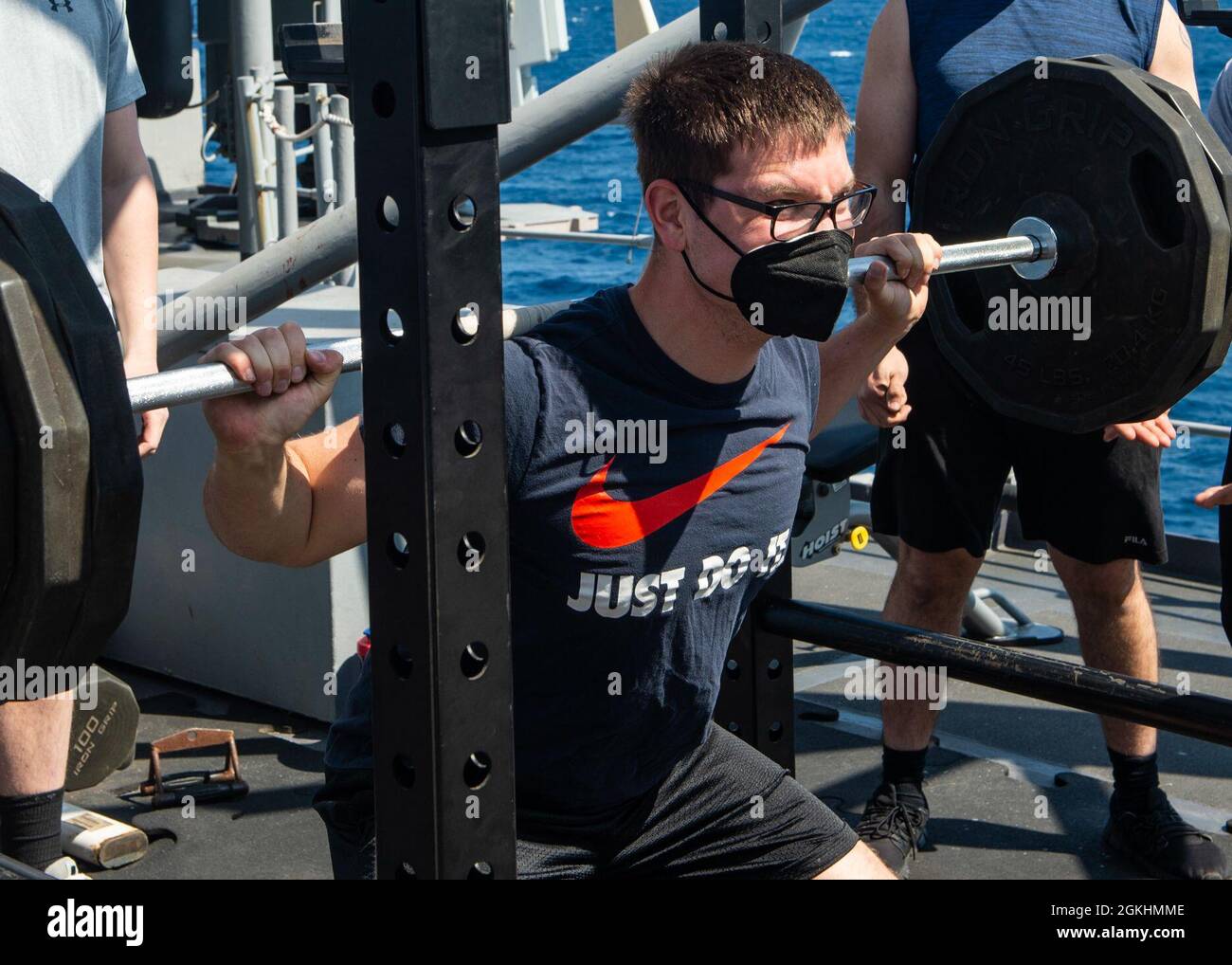 210425-N-RG587-1029 ATLANTIC OCEAN (April 25, 2021) Fire Controlman (Aeigis) 2nd Class Steven Brinker, from Johnstown, Ohio, competes in a weight-lifting competition aboard the Ticonderoga-class guided-missile cruiser USS Vella Gulf (CG 72), April 25, 2021. Vella Gulf is operating in the Atlantic Ocean in support of naval operations to maintain maritime stability and security in order to ensure access, deter aggression and defend U.S., allied and partner interests. Stock Photo