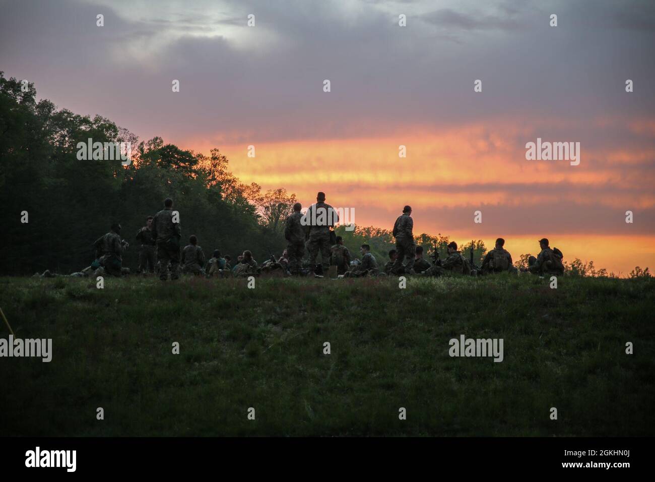 U.S. Marines with Headquarters and Service Battalion, U.S. Marine Corps Forces Command, standby prior to night time unknown distance live fire training Quantico, Virginia, April 25, 2021. During the field training exercise, Marines conducted land navigation and close, long and unknown distance shooting while building squad level operational cohesion. Stock Photo