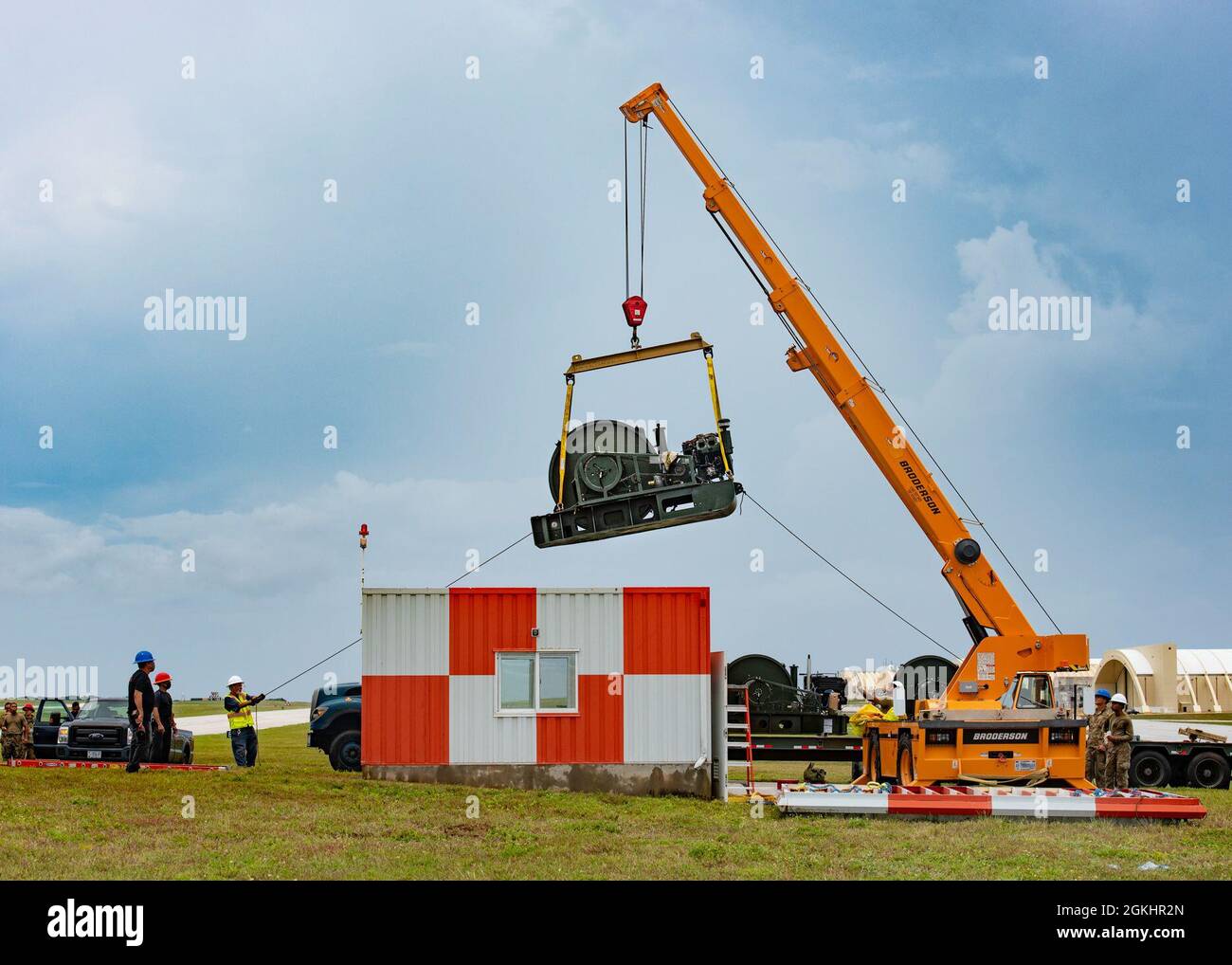 The 36th Civil Engineer Squadron removes the old Barrier Arresting Kit from the flight line at Andersen Air Force Base, Guam, April 26, 2021. According to the technical order, BAK-12s are overhauled and replaced every ten years. The BAK-12 feeds a cable across the flight line and, in the case of an in-flight emergency, acts as a mechanical barrier that rapidly decelerates a landing aircraft. Stock Photo