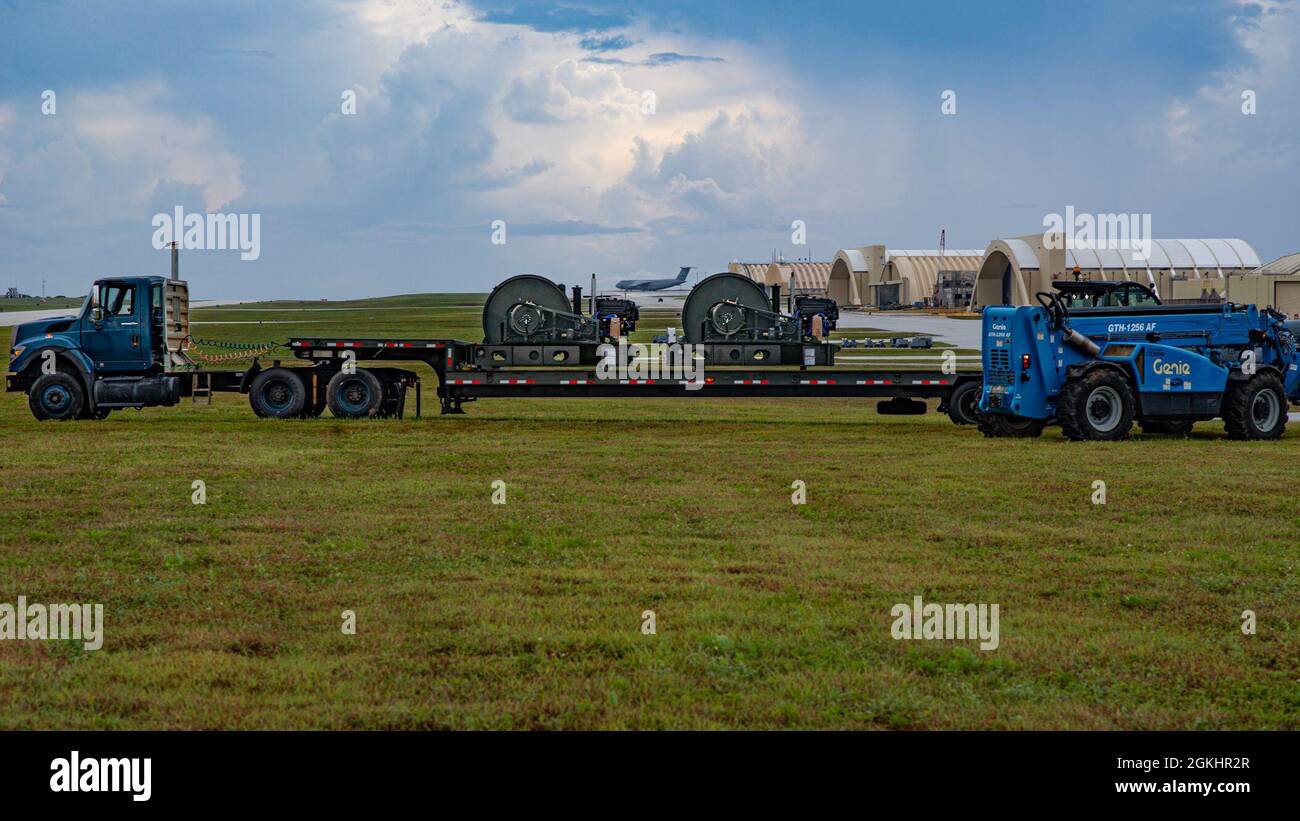 Two Barrier Arresting Kits sit on a trailer on the flight line at Andersen Air Force Base, Guam, April 26, 2021. According to the technical order, BAK-12s are overhauled and replaced every ten years. The BAK-12 feeds a cable across the flight line and, in the case of an in-flight emergency, acts as a mechanical barrier that rapidly decelerates a landing aircraft. Stock Photo